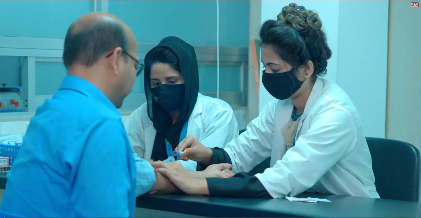 Doctors consulting with patient